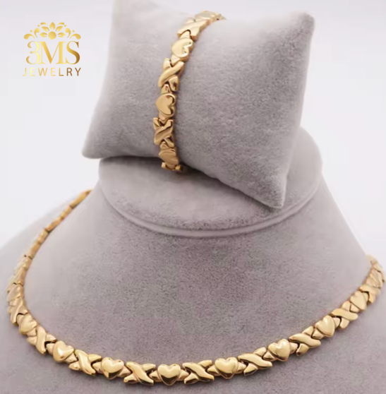 "Gold heart design necklace and bracelet in 18k gold vermeil—front full view"